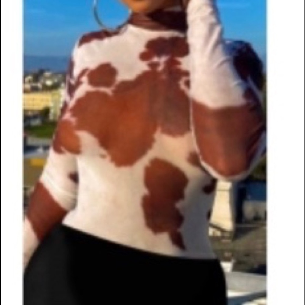 Orange cow print shirt